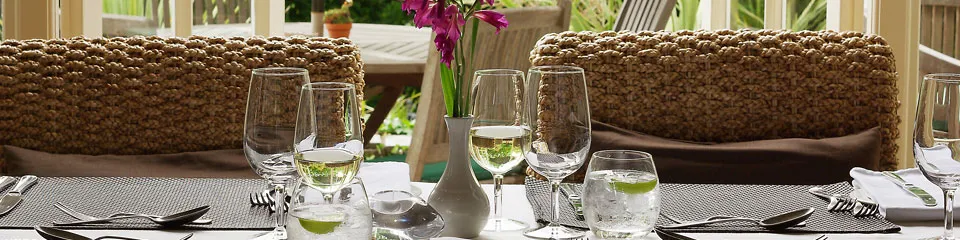 A dinner table laid for service at Plantation House